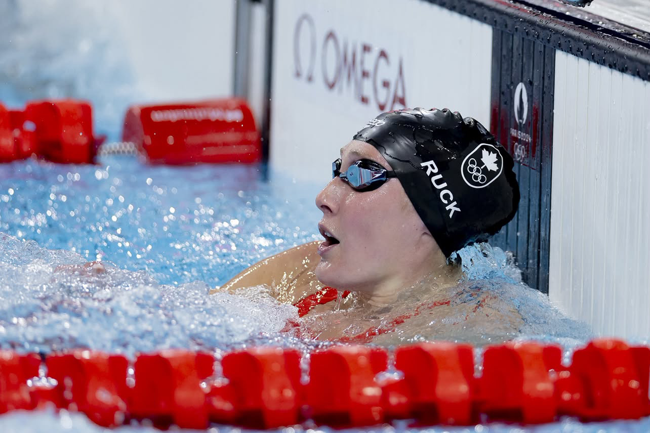 Taylor Ruck catching her breath at the wall after an Olympic final in Paris