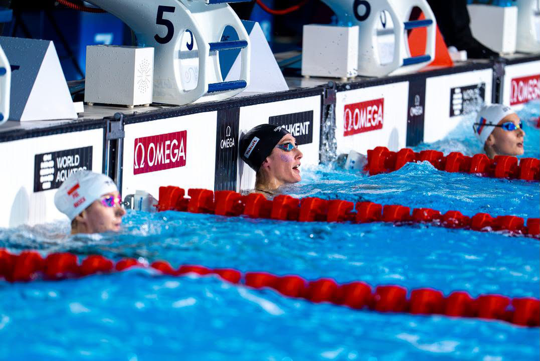 Taylor Ruck looking up at the scoreboard after a race at the World Aquatics Championships